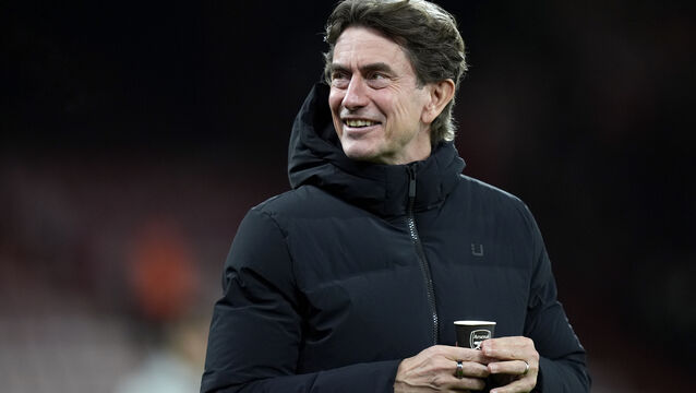 <p>Tottenham manager Thomas Frank was unaware he was drinking from a cup with an Arsenal badge on it. Pic: Andrew Matthews/PA</p>