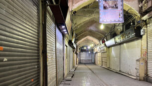 Shops are closed during protests in Tehran’s centuries-old main bazaar (Vahid Salemi/AP)
