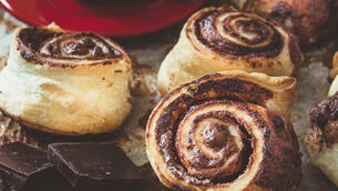 <p> Sweet danish chocolate pastry and cup of coffee,selective focus</p>