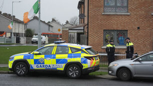 <p>Members of An Garda outside a property in the Cherry Orchard area of Ballyfermot, west Dublin, where the body of a man in his 40s was found. Picture: PA</p>