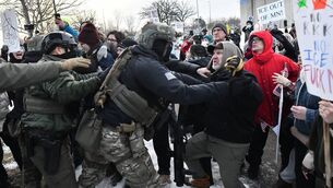 <p>Protestors clash with federal agents in Saint Paul, Minnesota after a US Immigration and Customs Enforcement (ICE) agent shot and killed 37-year-old Renee Nicole Good in her car on the streets of Minneapolis. Picture: Octavio Jones/AFP/Getty </p>