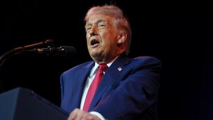 <p>US president Donald Trump is now behaving like a mad king. He instructs, those around him scurry off to respond, and the world falls into place. Picture: Evan Vucci/AP</p>