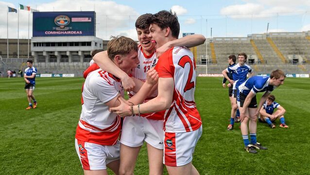 <p>Pobalscoil Chorca Duibhne players Cian Ó Murchú, left, Conchúir Ó Géibheannaigh, centre, and Tadhg de Brún celebrate winning the 2014 Hogan Cup. Pic: Piaras Ó Mídheach / SPORTSFILE</p>