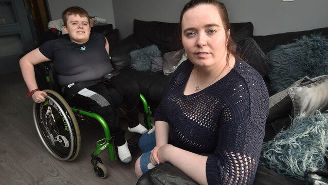 <p> A 2021 file photo of Amanda Coughlan Santry with her son TJ who suffers from spina bifida at home in Tullamore, Co Offaly. The support group she co-founded had a 'very positive, very constructive' meeting in recent days. Picture: Ray Ryan</p>