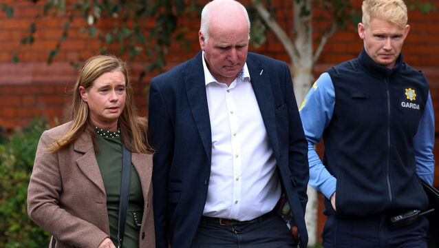 <p> Derrdre and Joe Mescall from Kilnamona, Co Clare, whose 14-year-old daughter Sarah Mescall died after inhaling an aerosol as part of a Tiktok challenge, leaving Dublin District Coroner's Court last October with Garda Luke Doyle of Crumlin Garda Station. Picture: Colin Keegan/Collins</p>