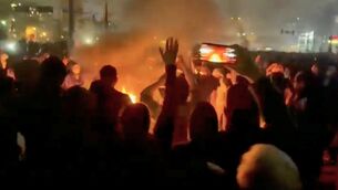 <p>A video grab from footage circulating on social media of protesters on the streets of Tehran. Economists warn that, in an already fraught geopolitical situation, events in the US, Iran, Venezuela, or Greenland could plunge the world into recession. Picture: UGC/AP</p>