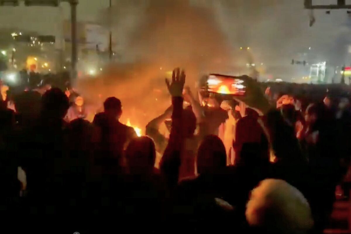 In this frame grab from footage circulating on social media shows protesters dancing and cheering around a bonfire as they take to the streets despite an intensifying crackdown as the Islamic Republic remains cut off from the rest of the world, in Tehran, Iran, Friday, Jan. 9, 2026. Picture: UGC via AP