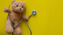 close up teddy bear as paediatrician with stethoscope on yellow color background for representative of medical as kid and childh