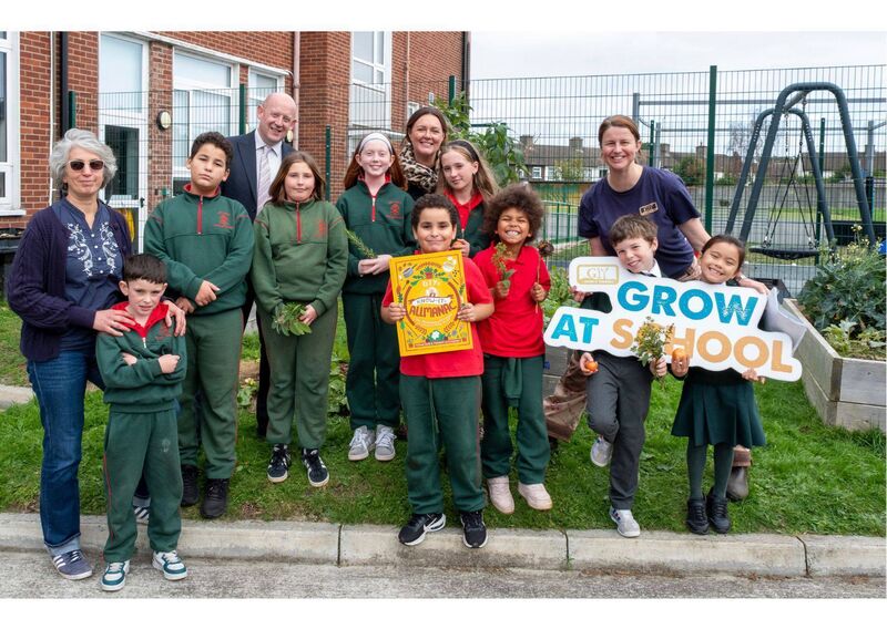 David O’Hanlon, FBD branch manager and Mary Bishop, GIY head of education with pupils and staff in the vegetable garden at Our Lady’s National School Clonskeagh. 