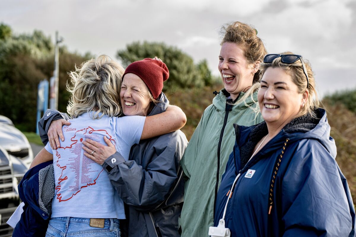 Smiles and hugs on the shore as friends reunite to celebrate the Sea Fillies’ achievement at Inchydoney Beach. 