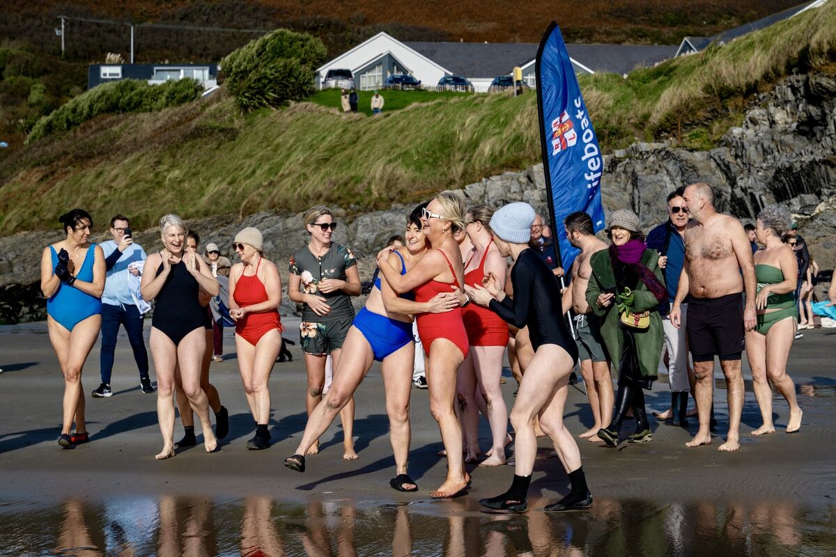 Orla Leahy and Biddy Hughes share an emotional embrace on Inchydoney Beach, surrounded by supporters ahead of their final Sea Fillies swim in aid of the RNLI. Picture Chani Anderson