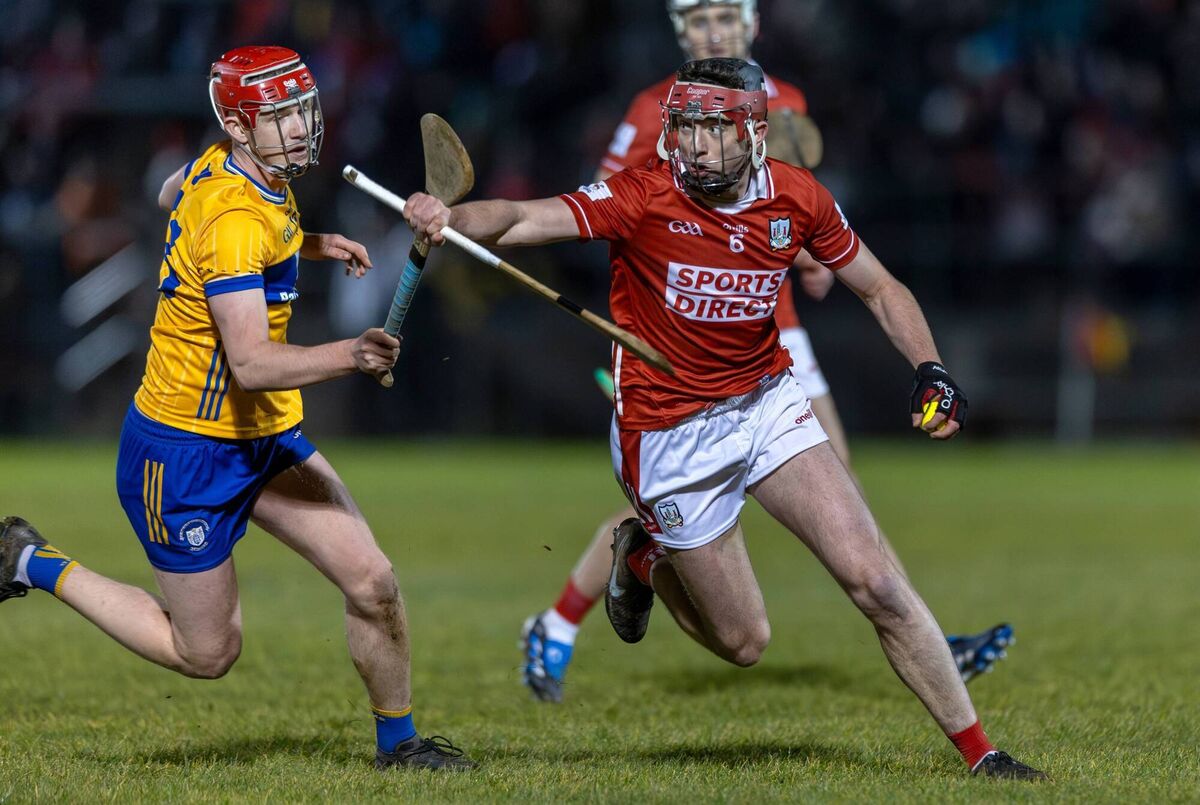 PRESENCE: Cork’s Alan Walsh goes past Senan Dunford of Clare. Pic: Natasha Barton