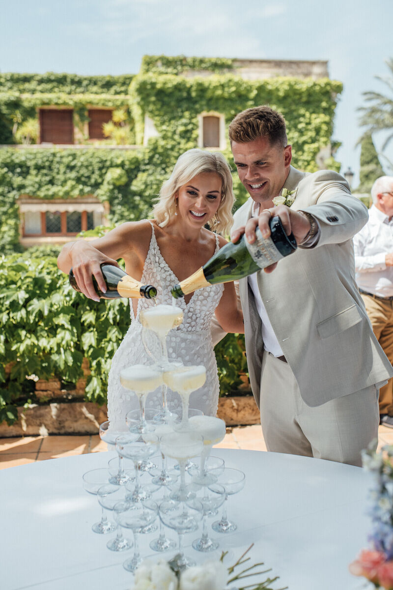 Ciara and Mark celebrate with Champagne.