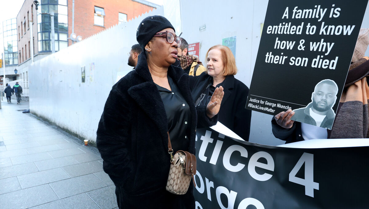 Blessing Nkencho (left), the mother of George walking past supporters at the Coroner’s Court for the inquest into her son's death. Photo: Leah Farrell/© RollingNews.ie