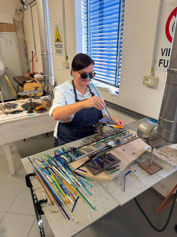 Esther McCarthy making Murano glass beads in Venice.