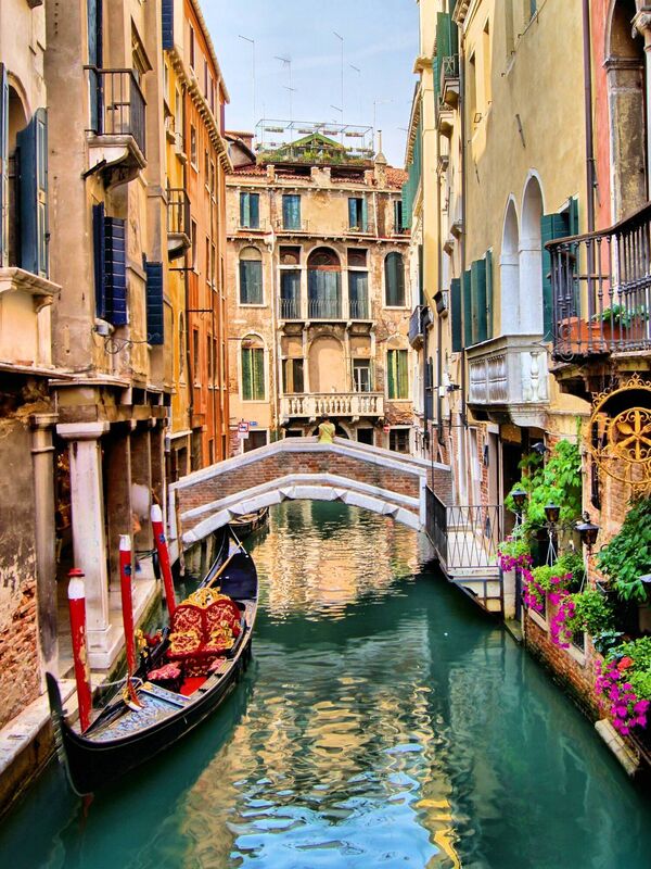 Canals crisscross Venice in a shimmering tangle