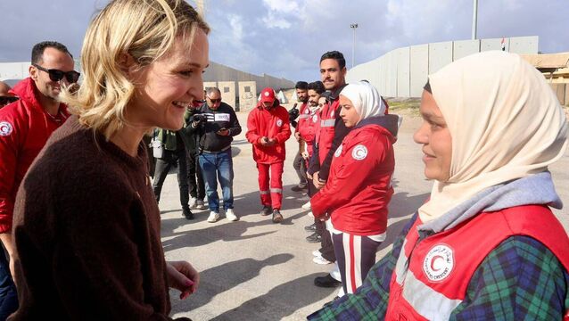 <p>Ireland's foreign minister Helen McEntee meeting Egyptian Red Crescent workers near the Rafah border. Ms McEntee heard how Israel has banned a long list of items including wheelchairs.  </p>