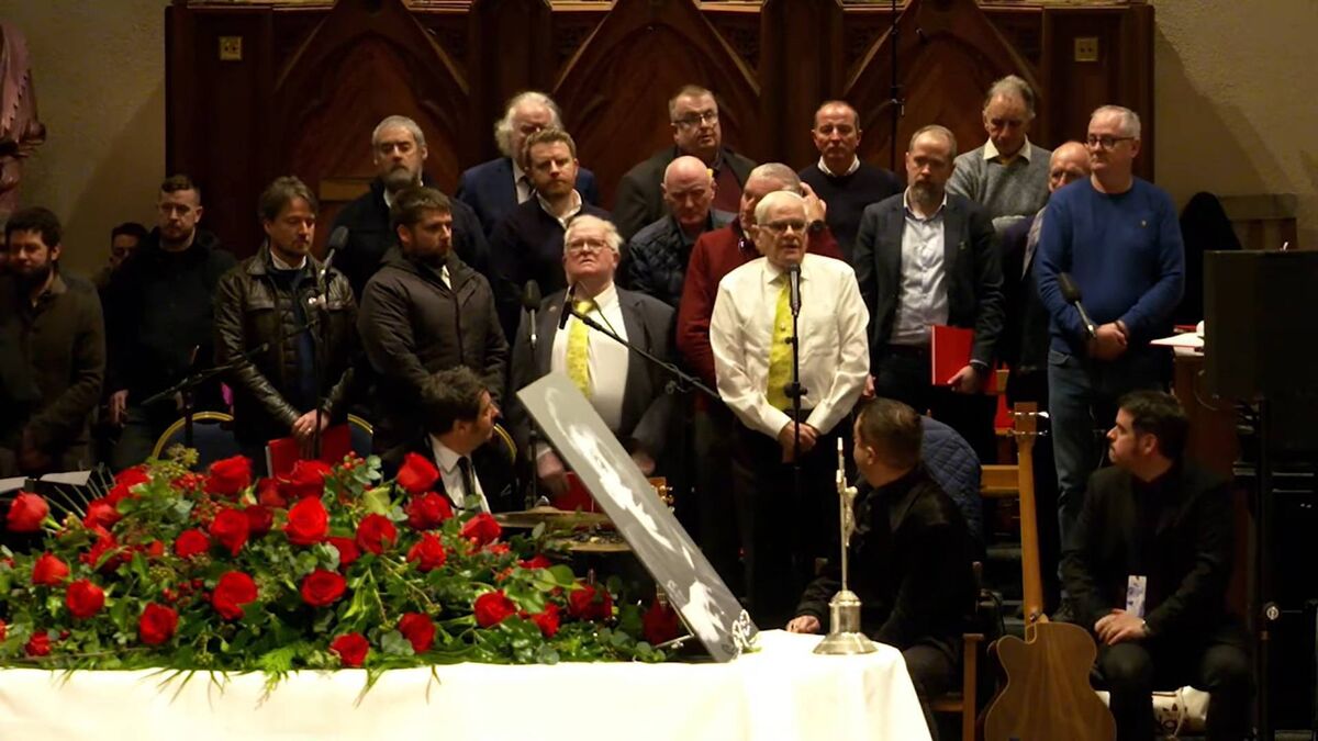 Séan Ó Sé and Cór Cúil Aodha performing at Shane MacGowan's  funeral in Nenagh in 2023.