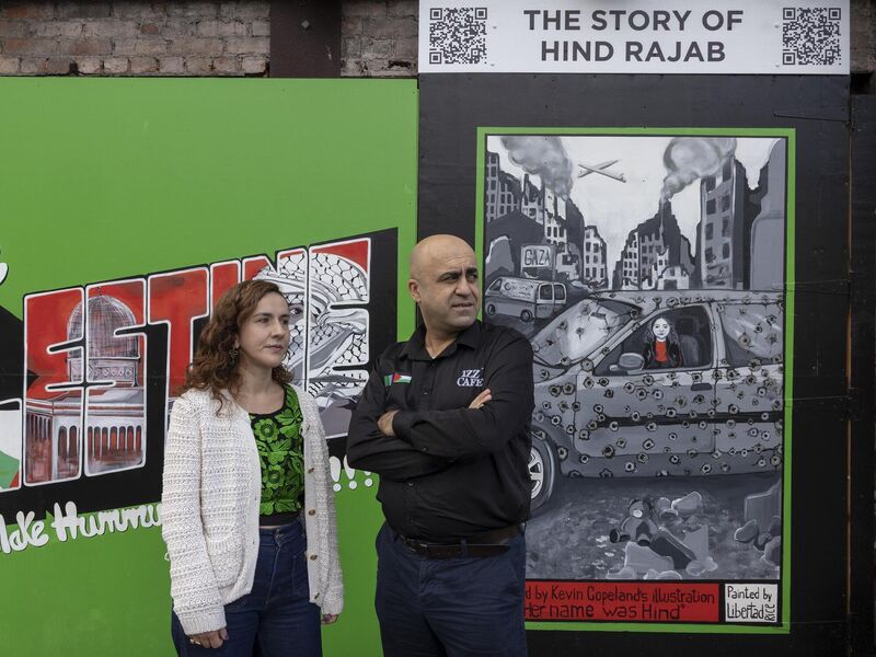 A mural tribute to Hind Rajab, at Izz Cafe in Cork. Pictured are artist Blanca Cabrera Rice and cafe owner Izz Alkarajeh. Picture: Clare Keogh