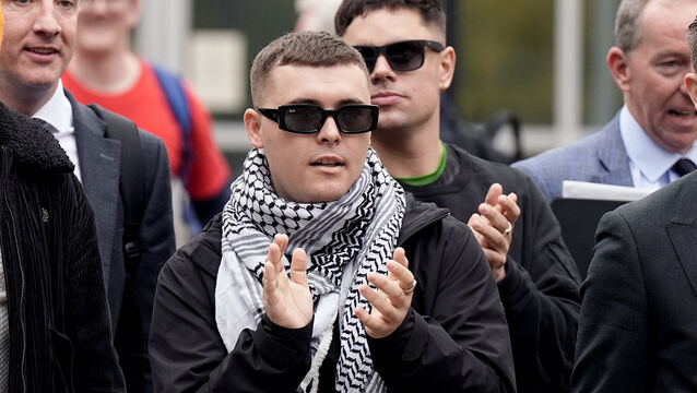 <p>Kneecap’s Liam Óg Ó hAnnaidh, who performs under the stage name Mo Chara, outside Woolwich Crown Court in September Picture: Aaron Chown/PA</p>