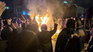 Iranians attend an anti-government protest in Tehran (UGC via AP, file)
