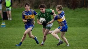 <p>Conor Clifford of St Pats Castleisland bursts through the tackle of Kevin Coffey. Pic: Domnick Walsh/Eye Focus</p>
