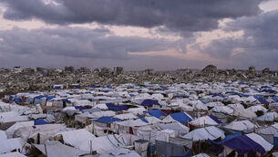 A tent camp for displaced Palestinians stretches across the Zeitoun neighbourhood of Gaza City (Jehad Alshrafi/AP)
