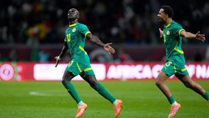 <p>Senegal's Sadio Mane, left, celebrates after scoring the winner. Pic: Themba Hadebe/AP</p>