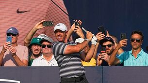 <p>Rory McIlroy hits off the first tee during the first round of Dubai Invitational. Pic: AP Photo/Fatima Shbair</p>