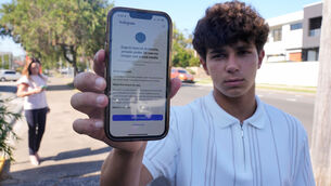 <p>Noah Jones shows a warning on his phone that says he cannot access a social media site. Australia's ban covers Twitch, Kick, YouTube, Threads, Facebook, Instagram, Snap, X, TikTok, and Reddit. Photo: AP/Rick Rycroft</p>