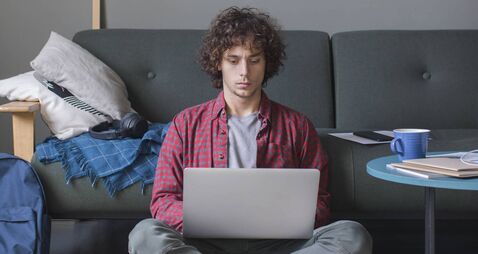 Learning and Studying from Home: a Diligent  College Student Attending an Online Course by Using his Laptop Computer