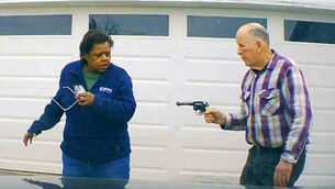 William Brock, right, holds a weapon to Uber driver Loletha Hall (Clark County Sheriff’s Office via AP)