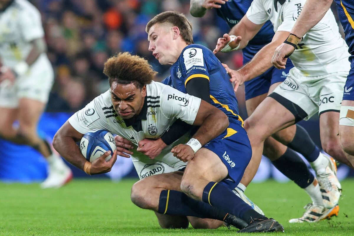 La Rochelle's Fijian centre Simeli Daunivucu is tackled by Leinster's Irish fly-half Sam Prendergast at the Aviva Stadium. Pic: Paul Faith / AFP via Getty Images