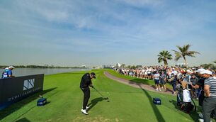 <p>Shane Lowry of Ireland plays his tee shot on the 18th hole. Pic: Ross Kinnaird/Getty Images</p>