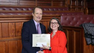 <p>Shay Bowen had been presented with a long service award by Court Services CEO, Angela Denning. </p>