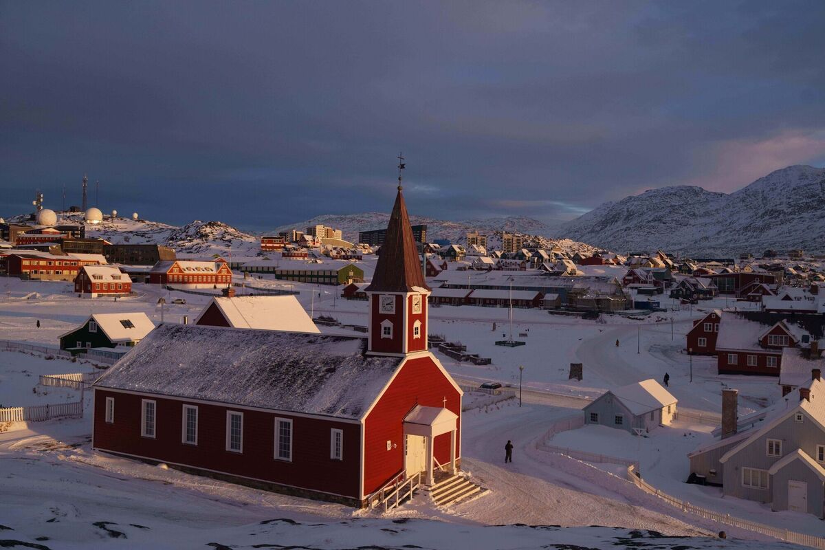 A man walks near the church in Nuuk, Greenland, on Wednesday, Jan. 14, 2026. (AP Photo/Evgeniy Maloletka)
