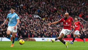 <p>Manchester United's Bryan Mbeumo scores their side's first goal. Pic: Martin Rickett/PA Wire.</p>