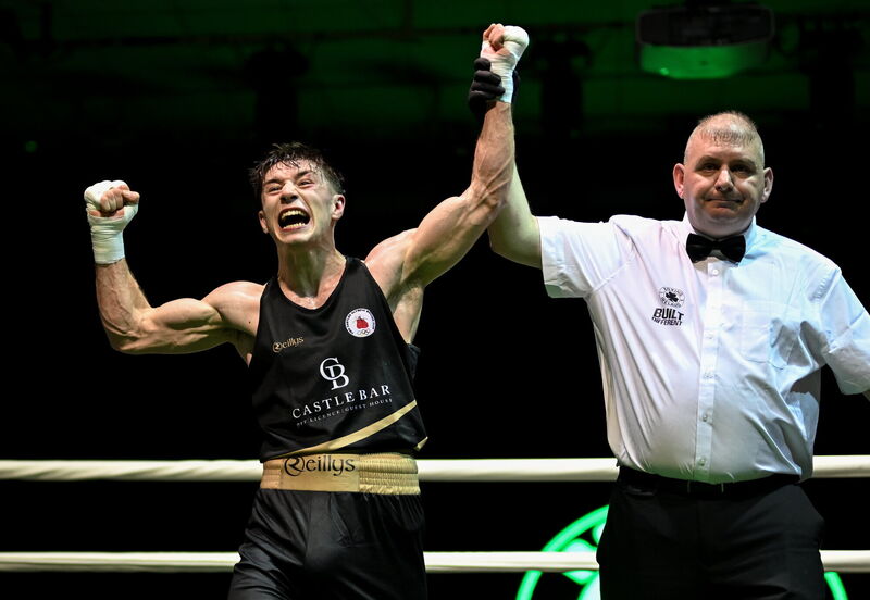 Jude Gallagher of Two Castles is declared victorious over Adam Hession in their 60kg final bout at the 2026 National Elite Boxing Championships. Pic: David Fitzgerald/Sportsfile