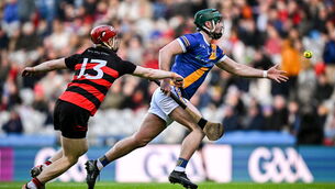 <p>Shane Morgan of Loughrea in action against Patrick Fitzgerald of Ballygunner. Pic: Seb Daly/Sportsfile</p>