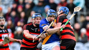 <p>Vince Morgan of Loughrea in action against Paddy Leavey, right, and Ian O'Neill of Ballygunner. Pic: Piaras Ó Mídheach/Sportsfile</p>