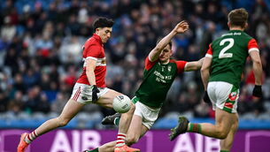 <p>Niall Geaney of Dingle in action against Shane Cunnane of St Brigid's. Pic: Seb Daly/Sportsfile</p>