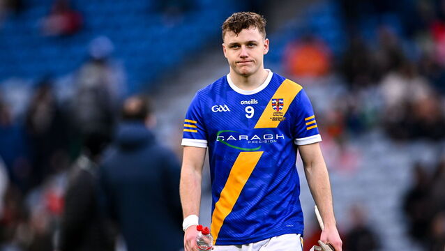 <p>Cullen Killeen of Loughrea leaves the pitch after his side's defeat. Pic: Piaras Ó Mídheach/Sportsfile</p>