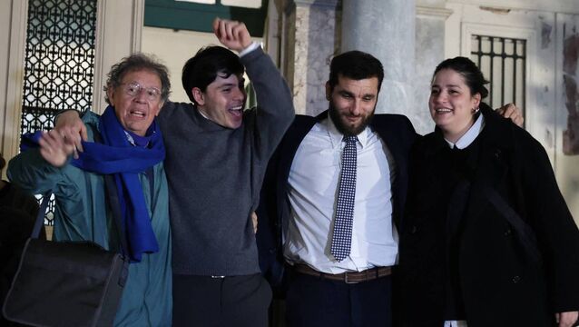 <p>Pieter Wittenberg, Sean Binder, Nasos Karaitsos, and Sarah Mardini exit the courthouse in Mytilene on January 15 after bring acquitted of migrant trafficking.	<span class="contextmenu emphasis CaptionCredit">Picture: Manolis Lagoutaris/Getty</span>
            </p>