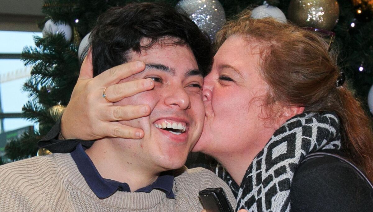 Sean Binder is welcomed home by his mother Fanny at Dublin Airport. Picture: Gareth Chaney Collins