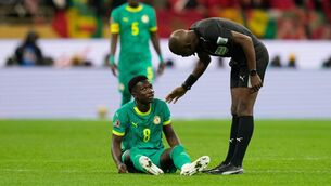 <p>DR Congo's referee Jean-Jacques Ndala checks on Senegal's Lamine Camara during the Africa Cup of Nations final. Pic: AP Photo/Mosa'ab Elshamy.</p>