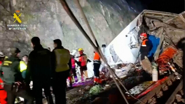 <p>Rescue workers at the scene after the high-speed train collision,in Adamuz, Spain. Picture: Guardia Civil screenshot via AP</p>