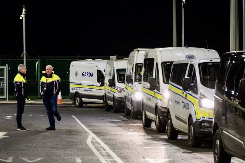 Garda vehicles, including prison vans, are driven onto the runway at Dublin Airport as part of Operation Trench. Picture: Chani Anderson Garda vehicles, including prison vans, are driven onto the runway at Dublin Airport as part of Operation Trench. Picture: Chani Anderson