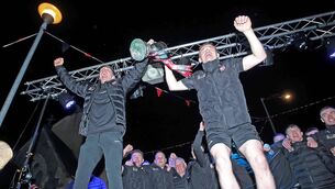 <p>GUNNING FOR GLORY: Ballygunner joint captains Peter Hogan and Mikey Mahony lift the cup at the homecoming in Ballygunner on Sunday night.</p>