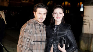 <p>Brooklyn Beckham (left) and Nicola Peltz arriving at the Burberry show at Tate Britain, London (Ian West/PA)</p>