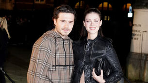 <p>Brooklyn Beckham (left) and Nicola Peltz arriving at the Burberry show at Tate Britain, London (Ian West/PA)</p>